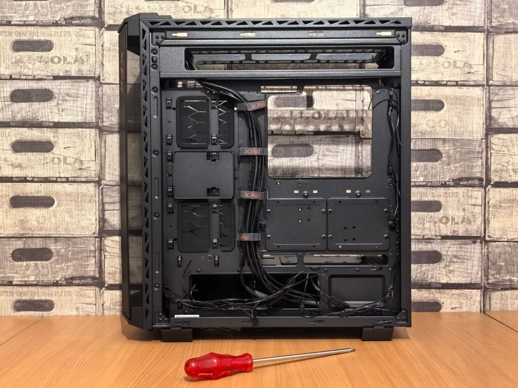 PC case side panel being removed without tools during tool-free PC building